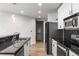 Modern kitchen with granite countertops, stainless steel appliances, and sleek cabinetry at 860 Peachtree Ne St # 2118, Atlanta, GA 30308