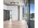 Light filled living room featuring hardwood floors, a modern ceiling, and expansive windows at 860 Peachtree Ne St # 2118, Atlanta, GA 30308