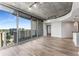 Bright living room with city views, wood floors, and modern lighting at 860 Peachtree Ne St # 2118, Atlanta, GA 30308