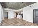 Open living room with modern floors, lighting, and access to the kitchen at 860 Peachtree Ne St # 2118, Atlanta, GA 30308