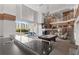 Bright lounge area with a pool table, fireplace, soaring ceilings, and a view of the city at 860 Peachtree Ne St # 2118, Atlanta, GA 30308