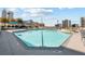 Rooftop pool surrounded by lounge chairs and a stunning view of the cityscape at 860 Peachtree Ne St # 2118, Atlanta, GA 30308