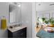 Bright half bath with granite countertops and modern fixtures at 1181 Cleburne Ne Ave, Atlanta, GA 30307