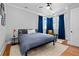 Well-lit bedroom featuring modern furnishings and a cozy corner with a comfortable chair at 1181 Cleburne Ne Ave, Atlanta, GA 30307