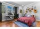 Bright bedroom with a large window, desk, and hardwood floors at 1181 Cleburne Ne Ave, Atlanta, GA 30307