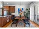 Dining area featuring a wooden table, stylish chairs, and modern light fixture at 1181 Cleburne Ne Ave, Atlanta, GA 30307