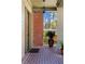Inviting front porch featuring brick flooring, and detailed woodwork at 1181 Cleburne Ne Ave, Atlanta, GA 30307