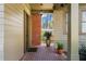 Inviting front porch featuring brick flooring, and detailed woodwork at 1181 Cleburne Ne Ave, Atlanta, GA 30307