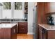 Modern kitchen featuring wood cabinetry, stainless steel appliances, and sleek countertops at 1181 Cleburne Ne Ave, Atlanta, GA 30307