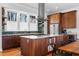 Kitchen with stainless steel appliances, quartz countertops, and built-in wine storage at 1181 Cleburne Ne Ave, Atlanta, GA 30307