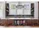 Close-up of kitchen island with built-in cookbook shelving and a modern design at 1181 Cleburne Ne Ave, Atlanta, GA 30307