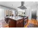 Kitchen with large island with cooktop, ample seating and views of the dining room at 1181 Cleburne Ne Ave, Atlanta, GA 30307
