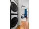 Modern laundry room with stacked washer/dryer near a bedroom entrance at 1181 Cleburne Ne Ave, Atlanta, GA 30307