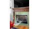 Close up of a fireplace with distinctive trim and green tile at 1181 Cleburne Ne Ave, Atlanta, GA 30307