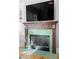 A fireplace with distinctive trim and green tile at 1181 Cleburne Ne Ave, Atlanta, GA 30307