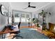 Well-lit work from home setup, complete with desk, chair, and sunny windows at 1181 Cleburne Ne Ave, Atlanta, GA 30307