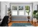 Bright home office bathed in natural light, accentuated by a light rug and various plants at 1181 Cleburne Ne Ave, Atlanta, GA 30307