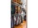 Spacious walk-in closet with extensive shelving, hanging racks, and hardwood flooring at 1181 Cleburne Ne Ave, Atlanta, GA 30307