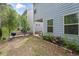 Backyard area with well-maintained landscaping featuring a barbecue grill at 138 Bryon Ln, Acworth, GA 30102