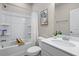Bright bathroom featuring a shower-tub combo with a decorative white shower curtain and crisp white finishes at 138 Bryon Ln, Acworth, GA 30102