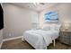 Cozy bedroom featuring hardwood floors and a serene painting of ocean waves above the bed at 138 Bryon Ln, Acworth, GA 30102