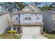 Charming two-story home with stone accents, a two-car garage, and lush landscaping at 138 Bryon Ln, Acworth, GA 30102