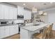 Bright kitchen features granite countertops, stainless steel appliances, and a large island with seating at 138 Bryon Ln, Acworth, GA 30102