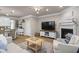 Open-concept living space featuring a cozy fireplace and seamless integration with the kitchen area at 138 Bryon Ln, Acworth, GA 30102
