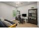 Cozy office space features a desk, storage shelves, and a futon couch, perfect for a home office setup at 138 Bryon Ln, Acworth, GA 30102