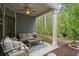 Outdoor patio area featuring a comfortable seating area and a ceiling fan for relaxing outside at 138 Bryon Ln, Acworth, GA 30102
