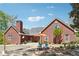 A spacious backyard with brick patio, built-in fire pit, seating and covered pool at 255 Helens Manor Dr, Lawrenceville, GA 30045