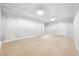 Unfinished basement with neutral carpet ready for personalization and customization to your desires at 255 Helens Manor Dr, Lawrenceville, GA 30045