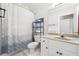 Bathroom with a shower-tub combo, toilet, and vanity, perfect for everyday needs and convenience at 255 Helens Manor Dr, Lawrenceville, GA 30045