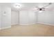 Bright bonus room with neutral carpet, updated ceiling fan and lighting, and clean white walls at 255 Helens Manor Dr, Lawrenceville, GA 30045