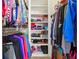 Walk-in closet with ample storage including shelves and hanging rods, perfect for organizing clothes and shoes at 255 Helens Manor Dr, Lawrenceville, GA 30045