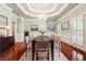 Formal dining room features hardwood floors, a decorative chandelier and wainscoting at 255 Helens Manor Dr, Lawrenceville, GA 30045