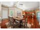 Open concept dining area with table, chairs, and barstool seating with an adjoining kitchen at 255 Helens Manor Dr, Lawrenceville, GA 30045