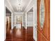 Bright entryway featuring hardwood floors and a decorative chandelier at 255 Helens Manor Dr, Lawrenceville, GA 30045