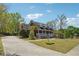 Charming two-story home with a long driveway and a well-manicured front lawn at 255 Helens Manor Dr, Lawrenceville, GA 30045