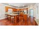 Beautiful kitchen featuring custom cabinets, granite countertops, a central island, and stainless steel appliances at 255 Helens Manor Dr, Lawrenceville, GA 30045