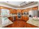 Modern kitchen with stainless steel appliances, granite countertops, wood cabinets, and natural light at 255 Helens Manor Dr, Lawrenceville, GA 30045