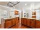 Gourmet kitchen with islands, granite countertops, stainless steel appliances, and custom cabinets at 255 Helens Manor Dr, Lawrenceville, GA 30045