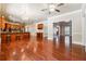 Open kitchen showcasing wood cabinets, breakfast bar, stainless appliances, and seamless flow into living spaces at 255 Helens Manor Dr, Lawrenceville, GA 30045