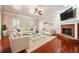 Inviting living room featuring a cozy fireplace, plush seating, and elegant decor for relaxation and entertainment at 255 Helens Manor Dr, Lawrenceville, GA 30045