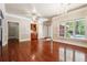 Spacious living area with gleaming hardwood floors, abundant natural light, and elegant architectural details at 255 Helens Manor Dr, Lawrenceville, GA 30045