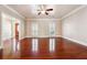 Spacious living room featuring gleaming hardwood floors and abundant natural light at 255 Helens Manor Dr, Lawrenceville, GA 30045