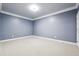 Empty room with carpeted floors, white trim, and neutral-painted walls, ideal for customization at 255 Helens Manor Dr, Lawrenceville, GA 30045