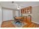 Cozy dining area with wood floors, custom built-ins, and charming light fixture at 30 Sweetwood Ct, Roswell, GA 30076