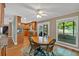 Bright dining area with wood floors next to kitchen and access to outdoor patio at 30 Sweetwood Ct, Roswell, GA 30076