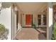 Inviting entryway with a vibrant red door, sidelights, and decorative plants at 30 Sweetwood Ct, Roswell, GA 30076
